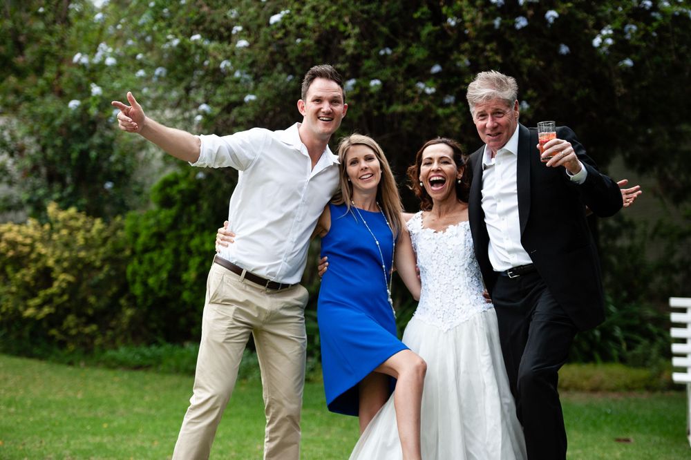 Wedding shoot showing the bride and groom with friends at the wedding