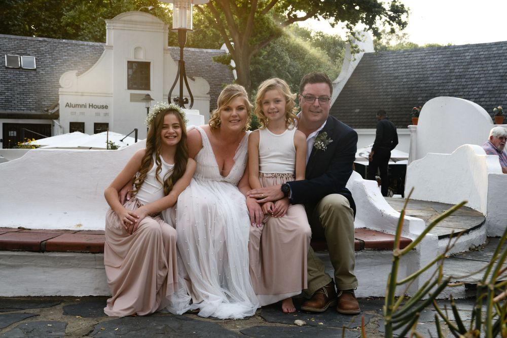 The bride and groom with their flower girls at their wedding shoot