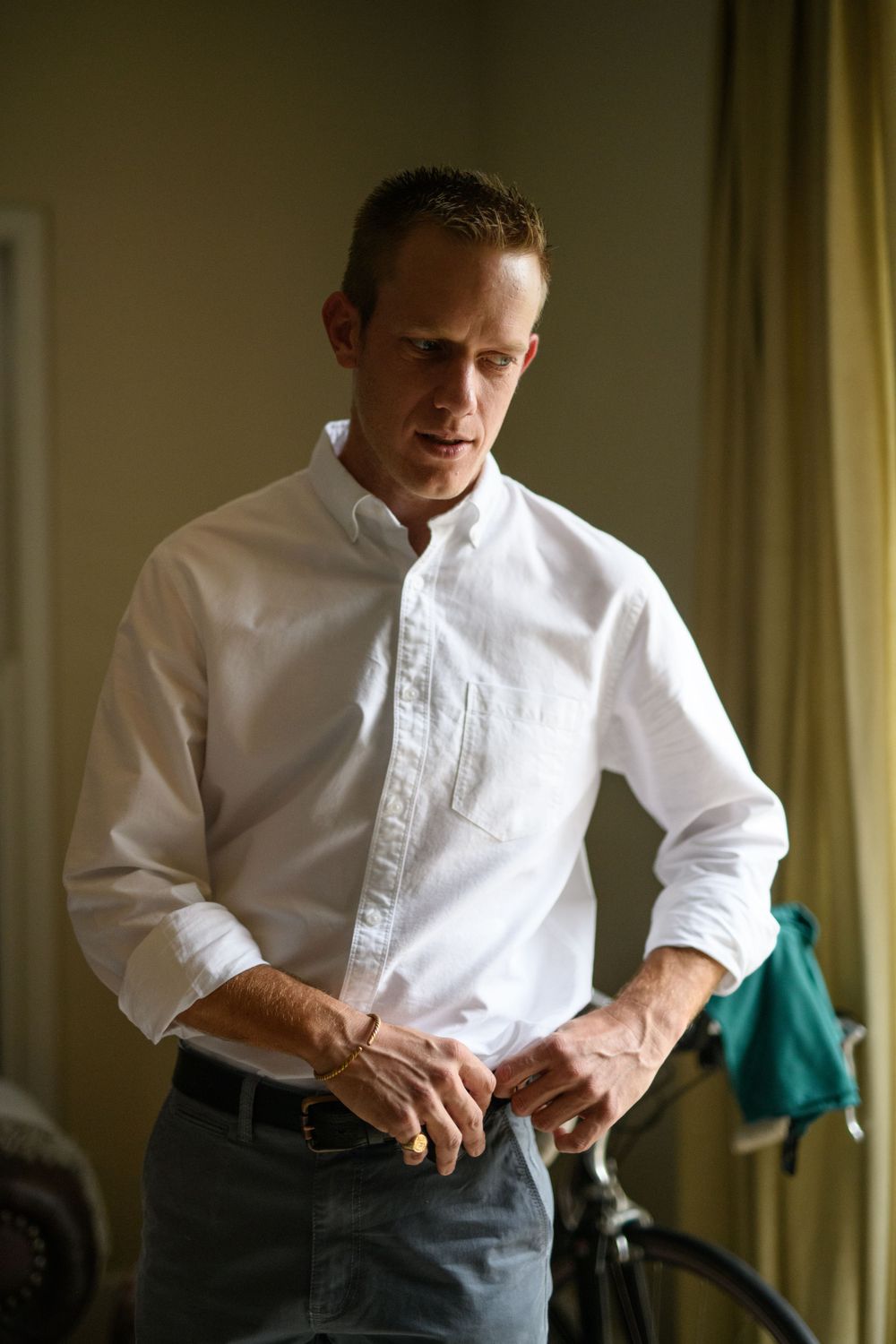 The groom getting ready for the wedding at their wedding shoot