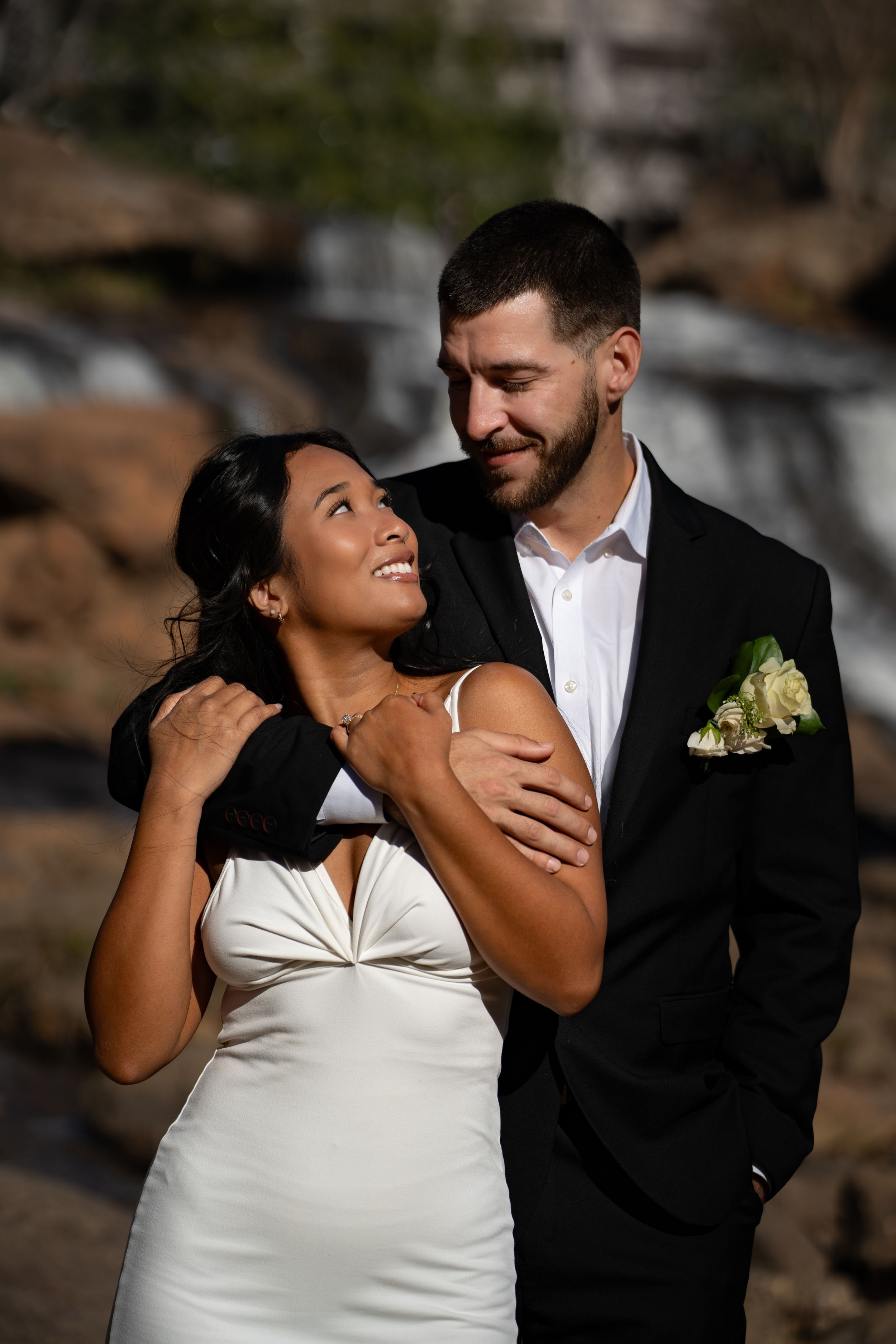 A series of romantic wedding photos showing a couple in formal attire sharing joyful moments against a natural backdrop.