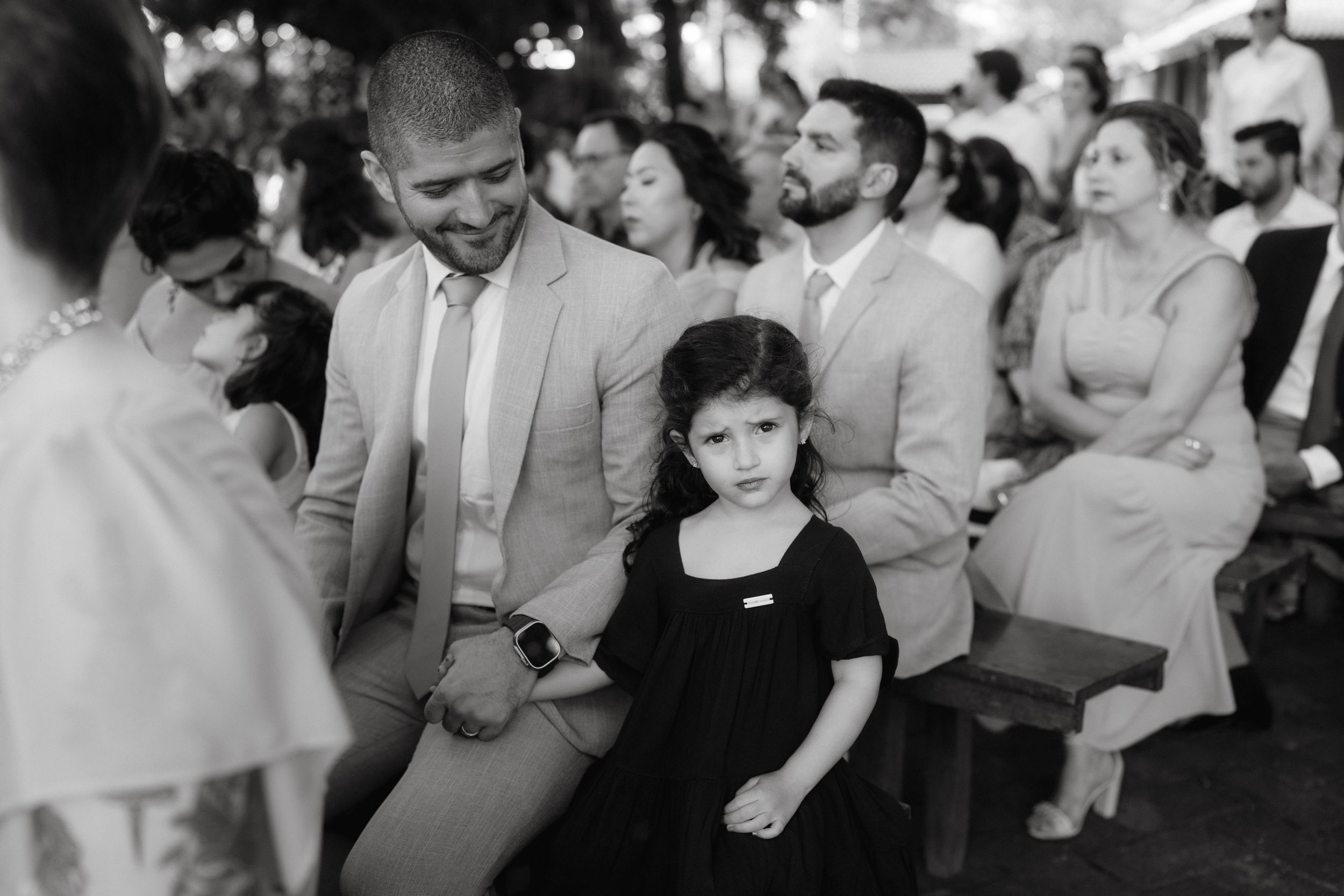 Black and white candid shot of wedding reception celebration.