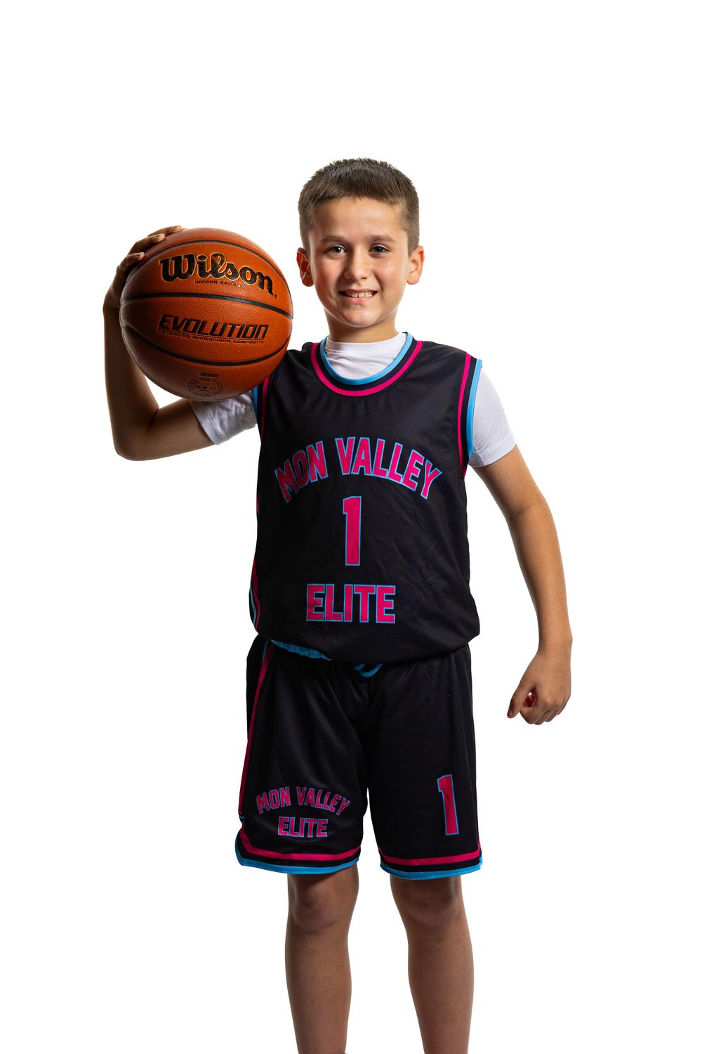 Youth basketball player in black and pink Sun Valley Elite uniform number 1 poses with Wilson basketball on white background.