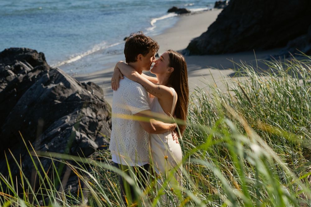A couple embracing at an Engagement Photoshoot at Deception Pass State Park in WA, Captured by Savvy Photography