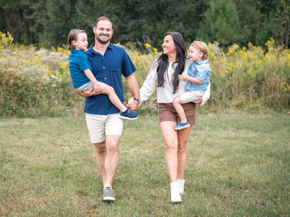 Candid moments captured during a casual outdoor family portrait session in nature.