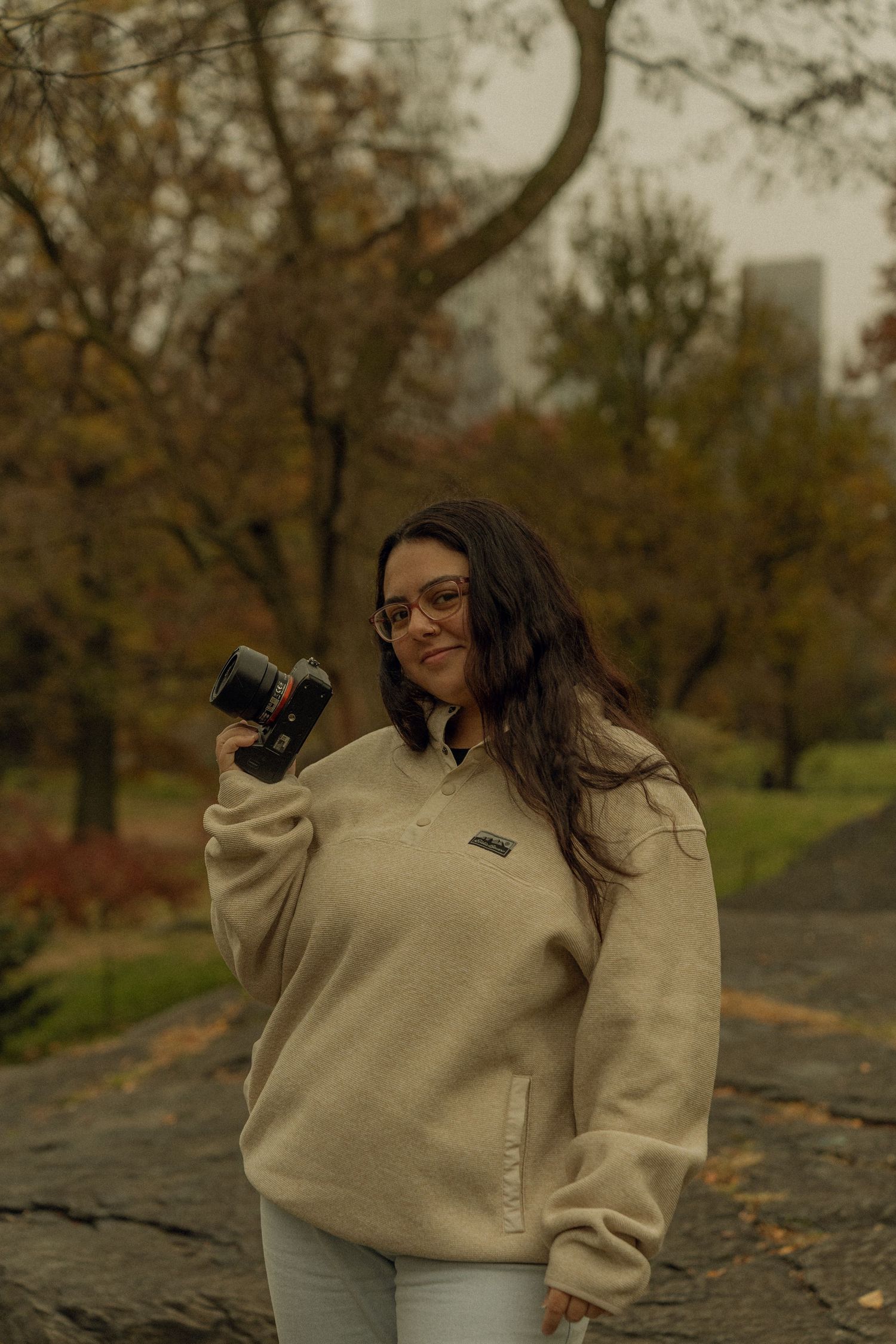 f (me) in Central Park - fall time - holding camera up - smiling