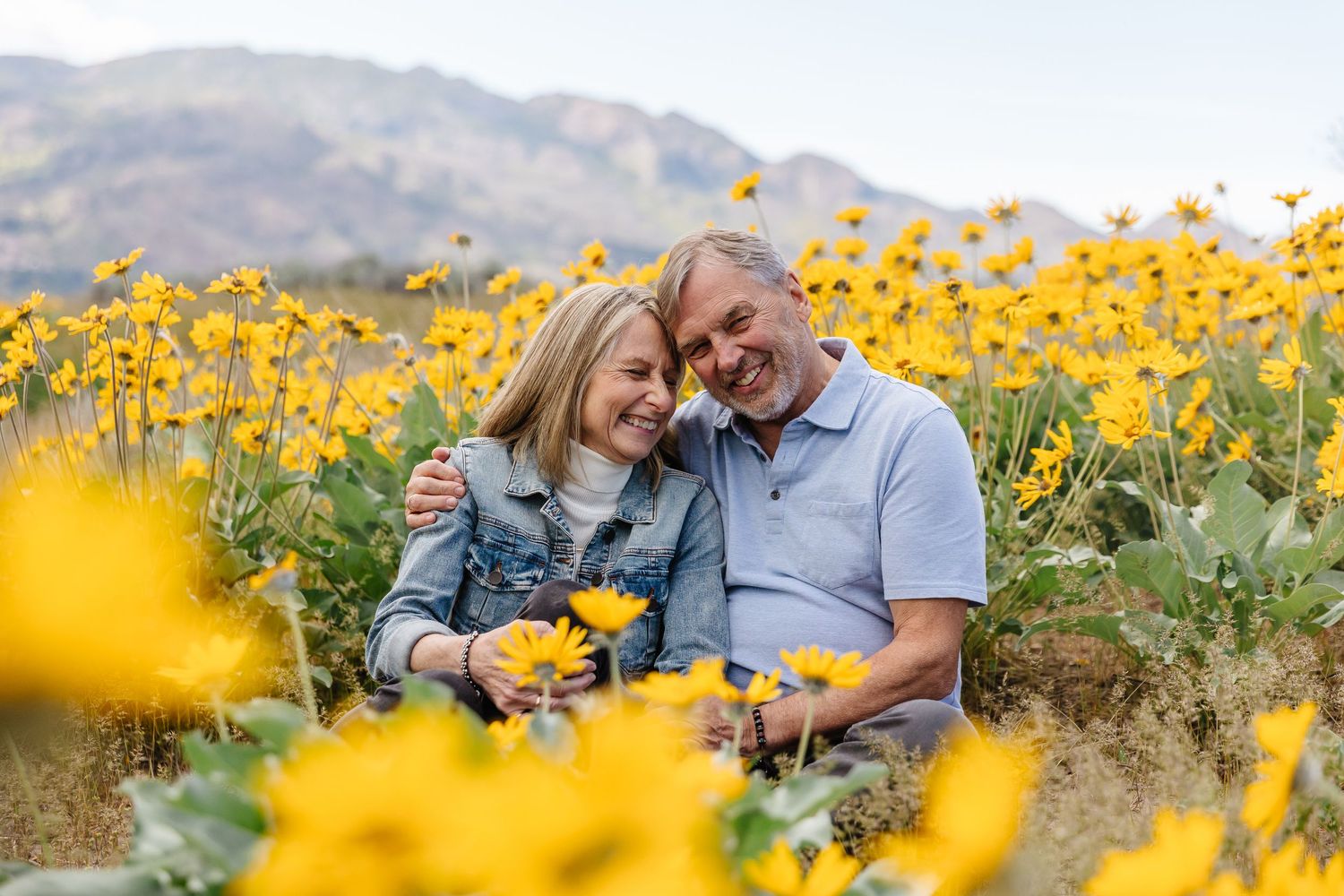 older couple photography in a flower field at sanctuary gardens in west kelowna during the spring time
