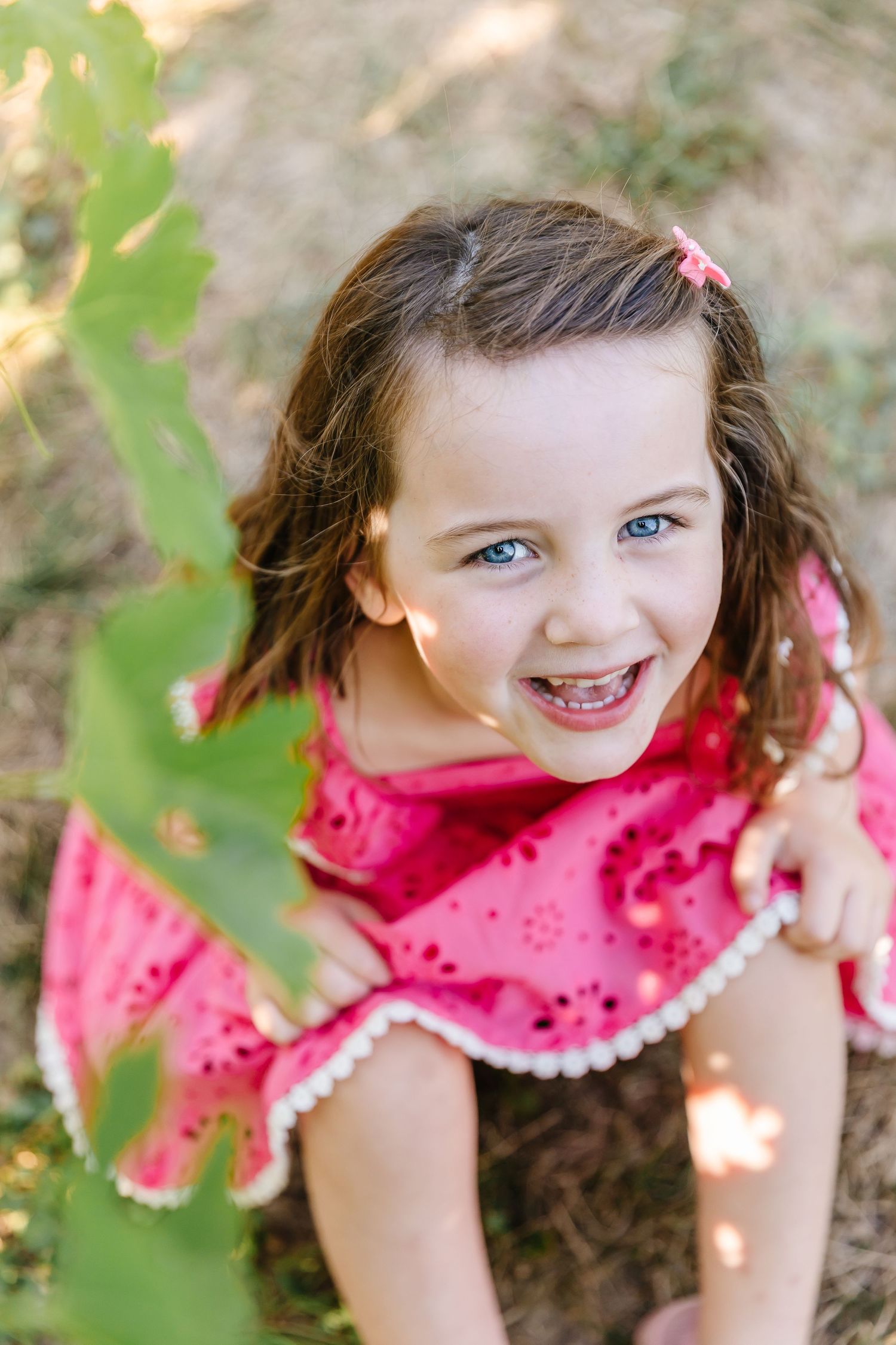 Close-up portrait sequence showing joyful expressions in a garden setting in the vineyard at quails gate in West Kelowna
