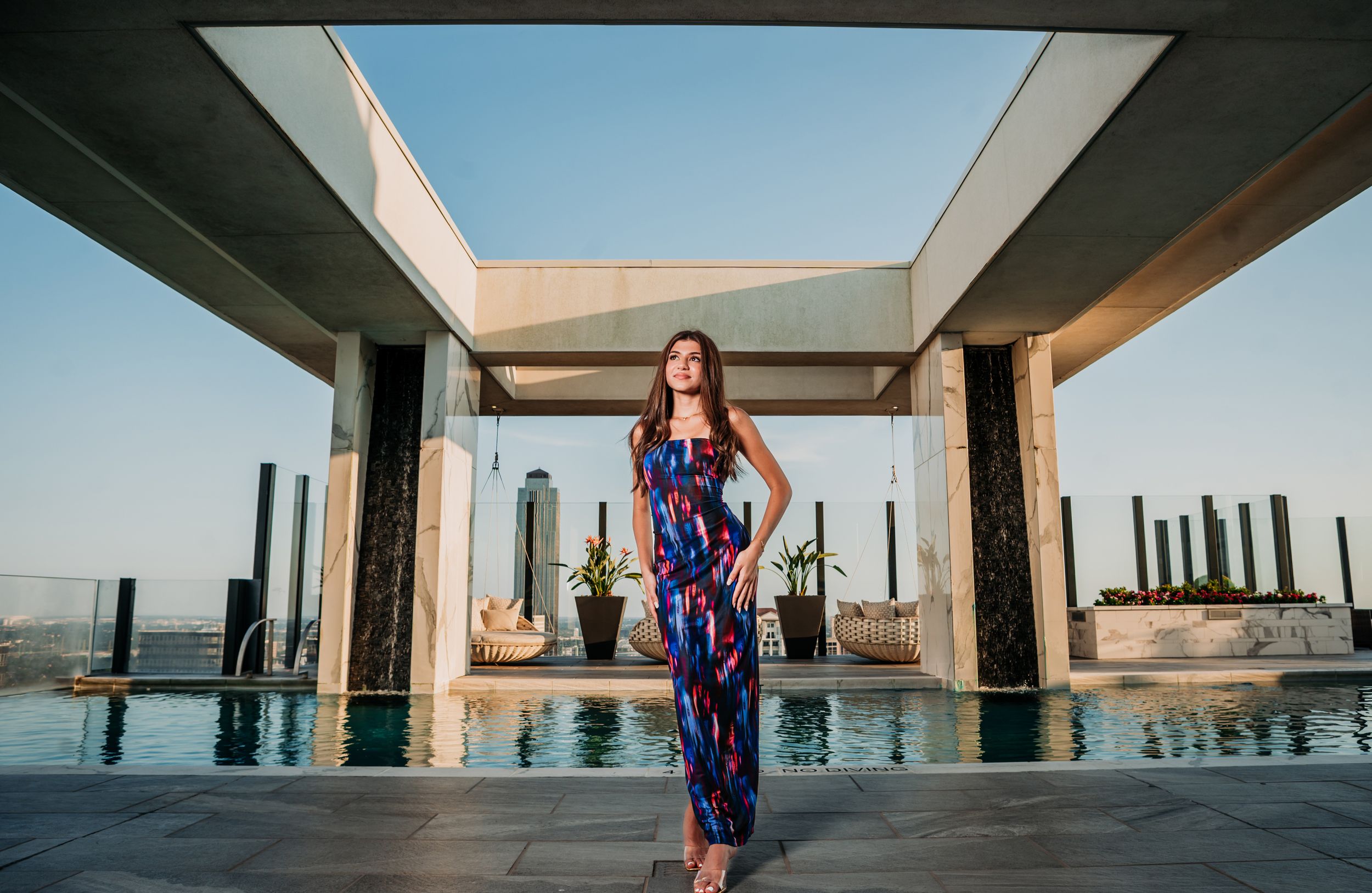 A series of architectural photographs showing modern buildings with reflective pools and geometric designs at sunset. Professional Headshot