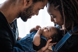 Intimate close-up portraits with denim and warm lighting create tender moments.