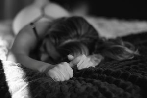 Luxury boudoir sessions featuring body jewelry, dramatic shadows, and confidence-driven posing.