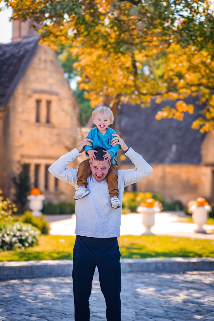 a father and son having fun and laughing in this candid picture