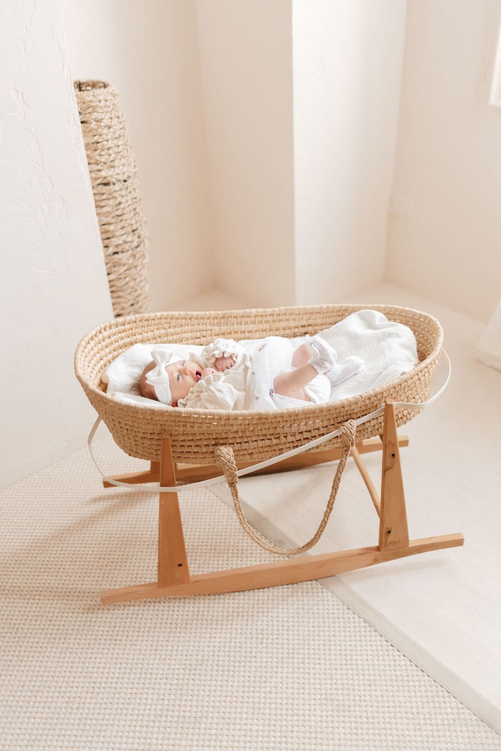 Newborn baby in bassinet during lifestyle studio session at Mint Room Studios, captured by Toronto newborn photographer Jess GC Photography