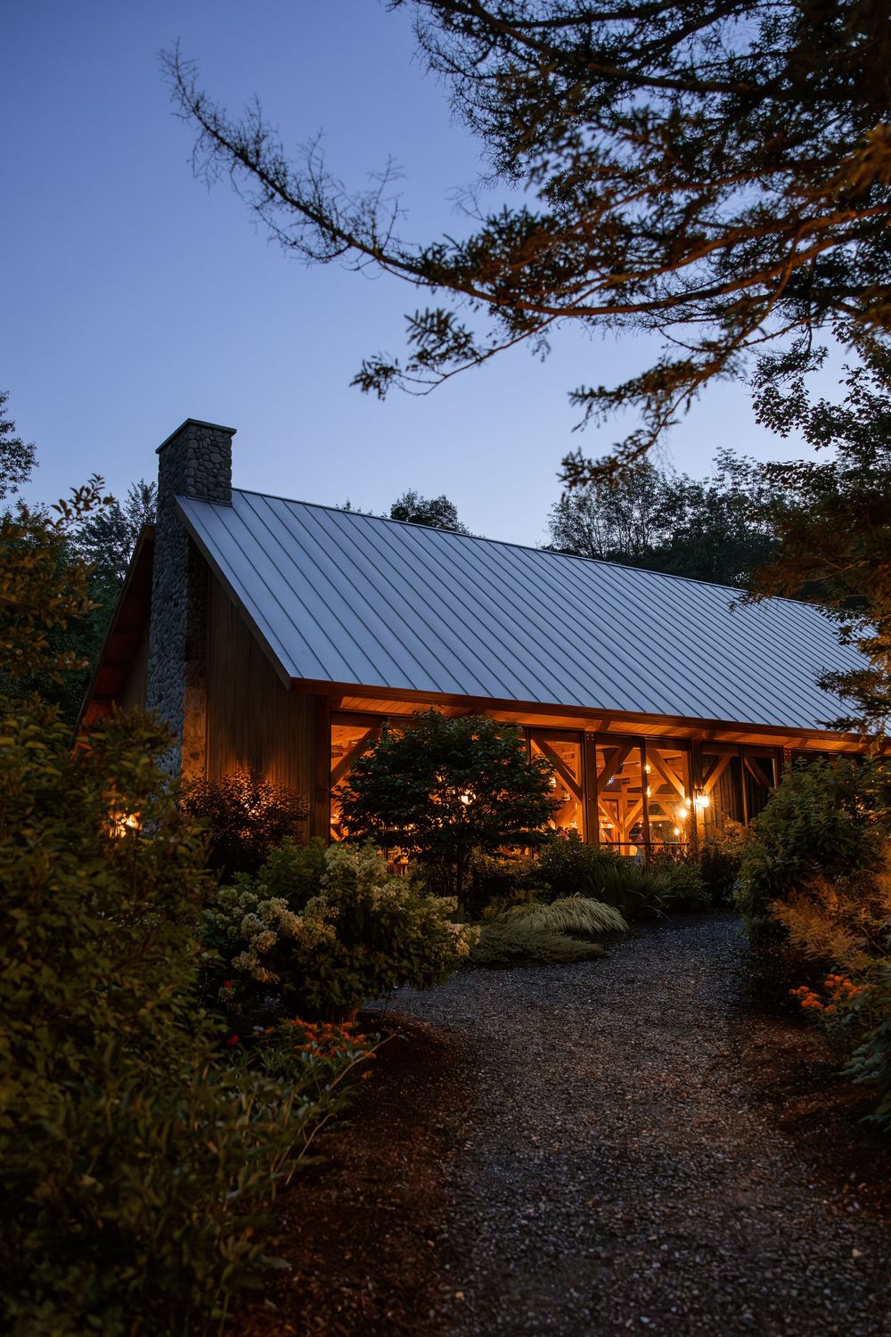 Outdoor wedding pavilion at night at the Mad River Barn in Waitsfield, Vermont. Boutique inn and pub are available for private gatherings.
