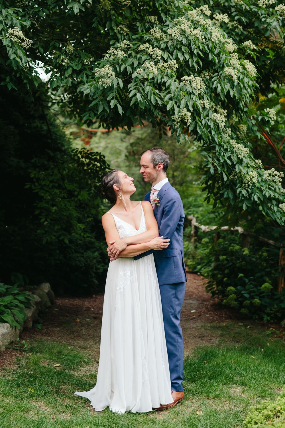 Natural candid portrait of bride and groom on their wedding day at  theLong Hill Estate in Beverly, Massachusetts