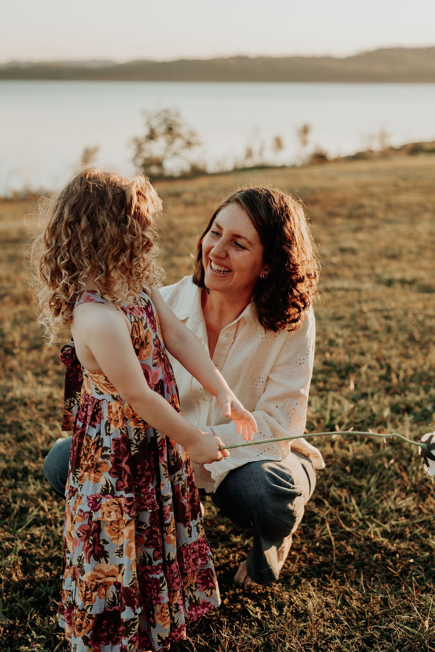 Candid sunset portrait session at awoonga dam gladstone with warm golden light.