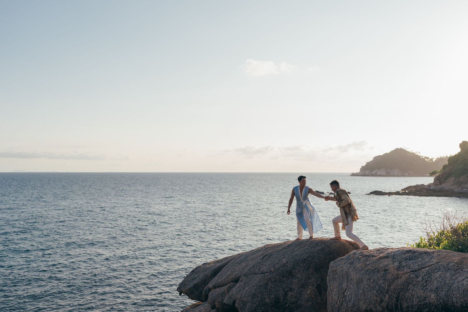 Same sex couple with sunset at Saidang resort in Koh Tao, Thailand
