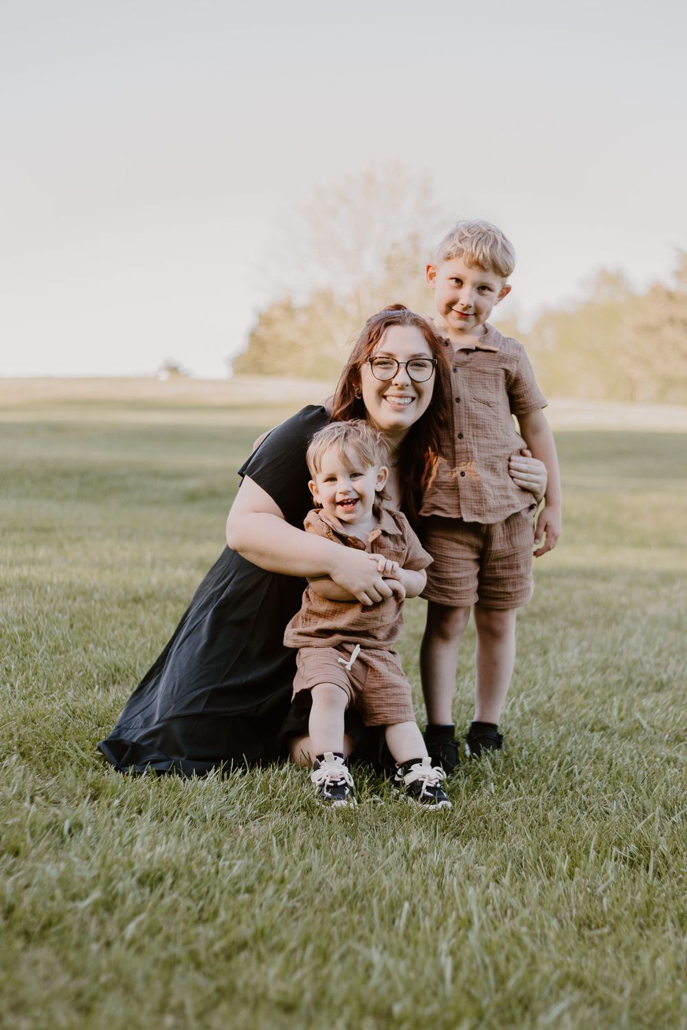 Mom and two son laughing in a field at Falling Creek Park in Bedford VA