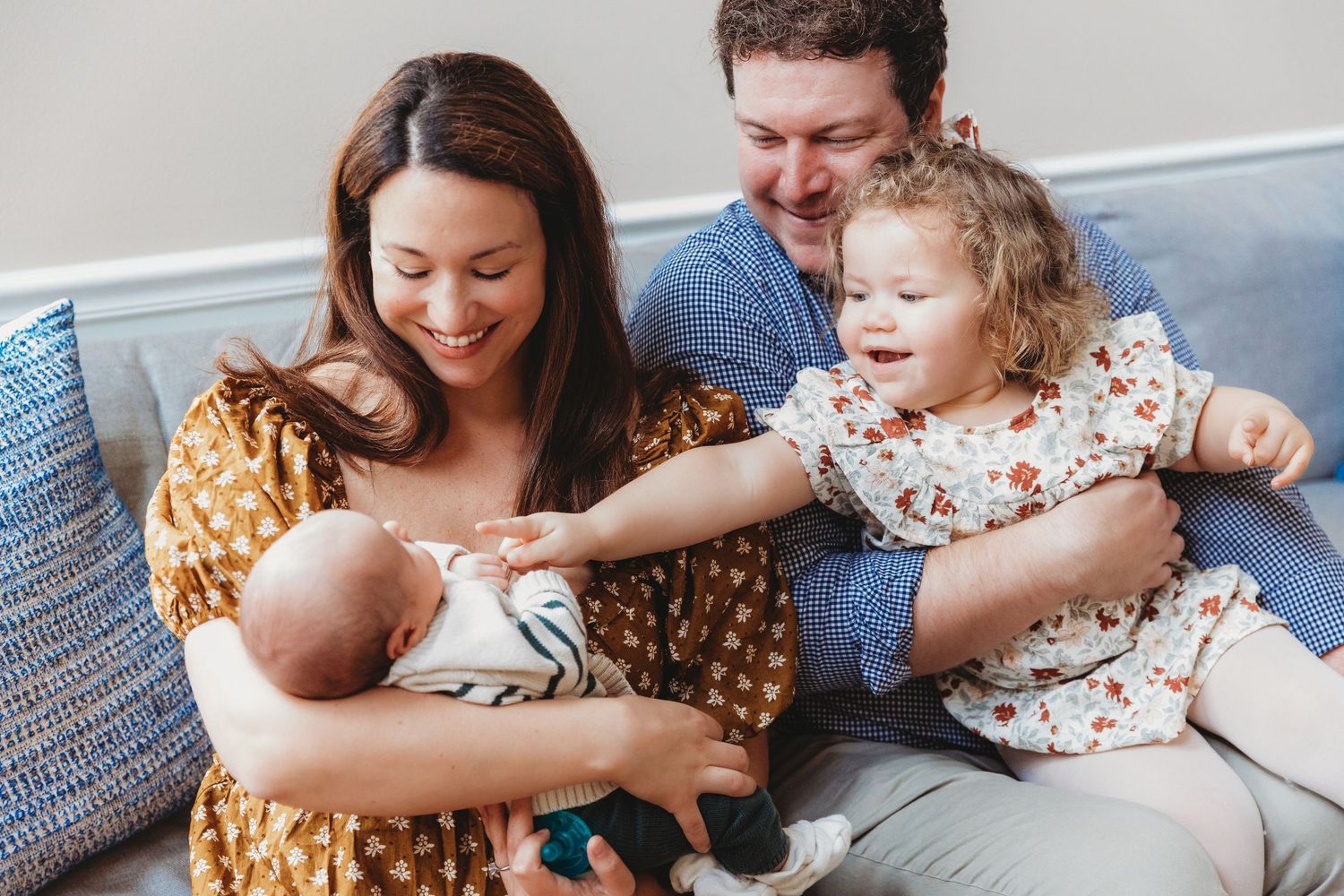 Candid family moments captured during indoor lifestyle photography session. Annapolis newborn photographer. Annapolis family photographer