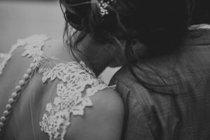 Close up detail of lace wedding dress pattern in black and white.