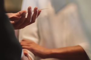 Close-up shot of hands during intimate conversation.