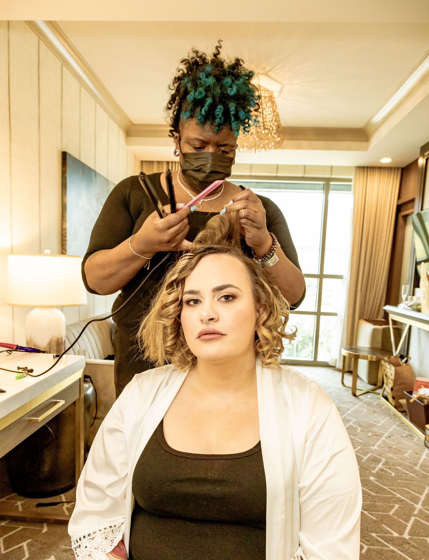BTS preparation in the bridal suite with soft lighting and elegant decor Shot by Zeus Holbrook | San Diego wedding Photographer