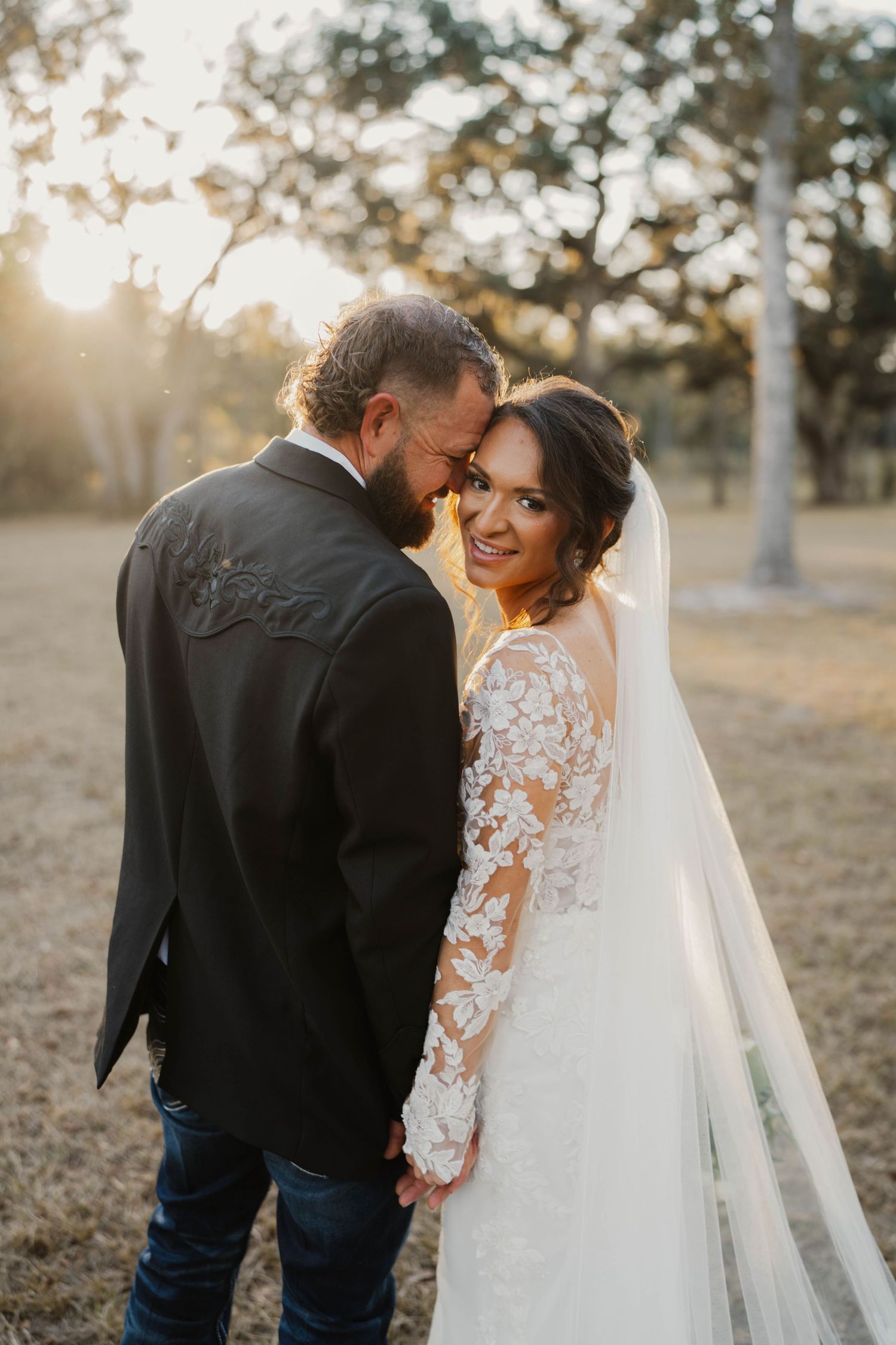Intimate wedding portrait sequence with flowing veil creating romantic moments.