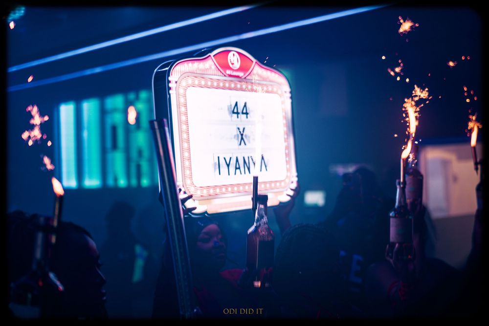 Neon signs and lights glowing in a dark urban environment create a moody cyberpunk atmosphere.