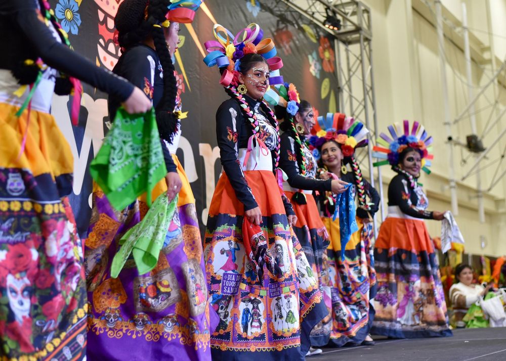 Photograph of Day of the Dead Dia de Los Muertos event with people in costume at the Community Center in San Rafael by William Wayland