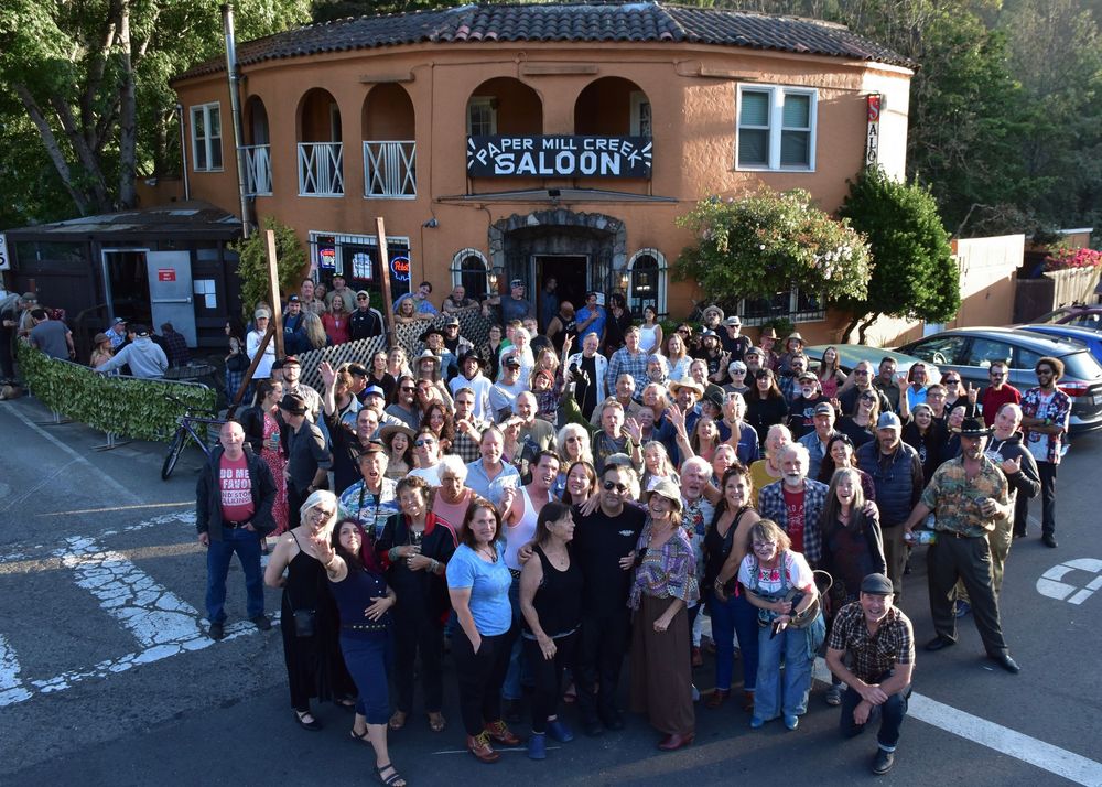 Photograph of a crowd of people outside the Paper Mill Creek Saloon in Forest Knolls by William Wayland