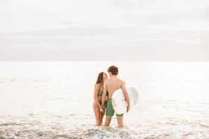 Photograph of couple in the surf