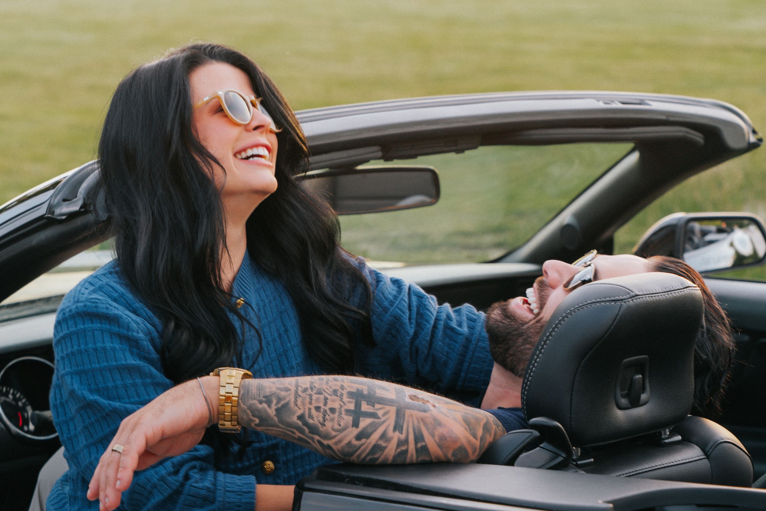 A sequence of shots showing someone leaning out of a car window while driving down a road.