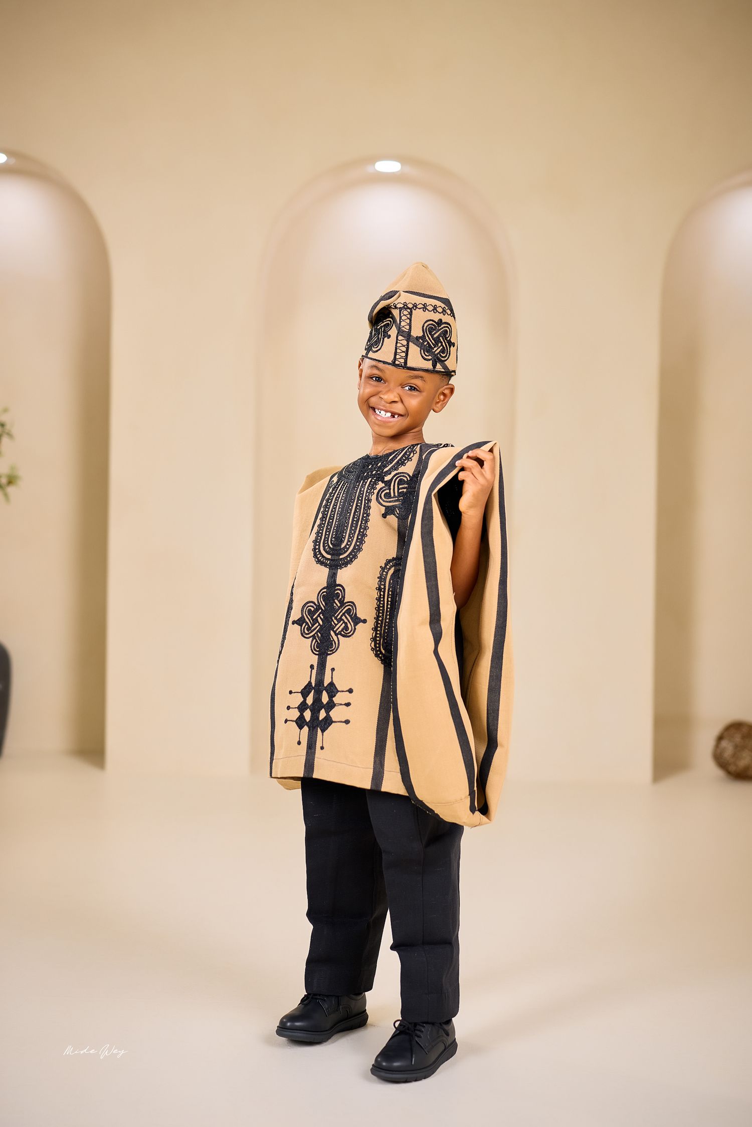 A series of artistic photos showing a person wearing baggy clothes and holding musical instruments against a beige wall.
