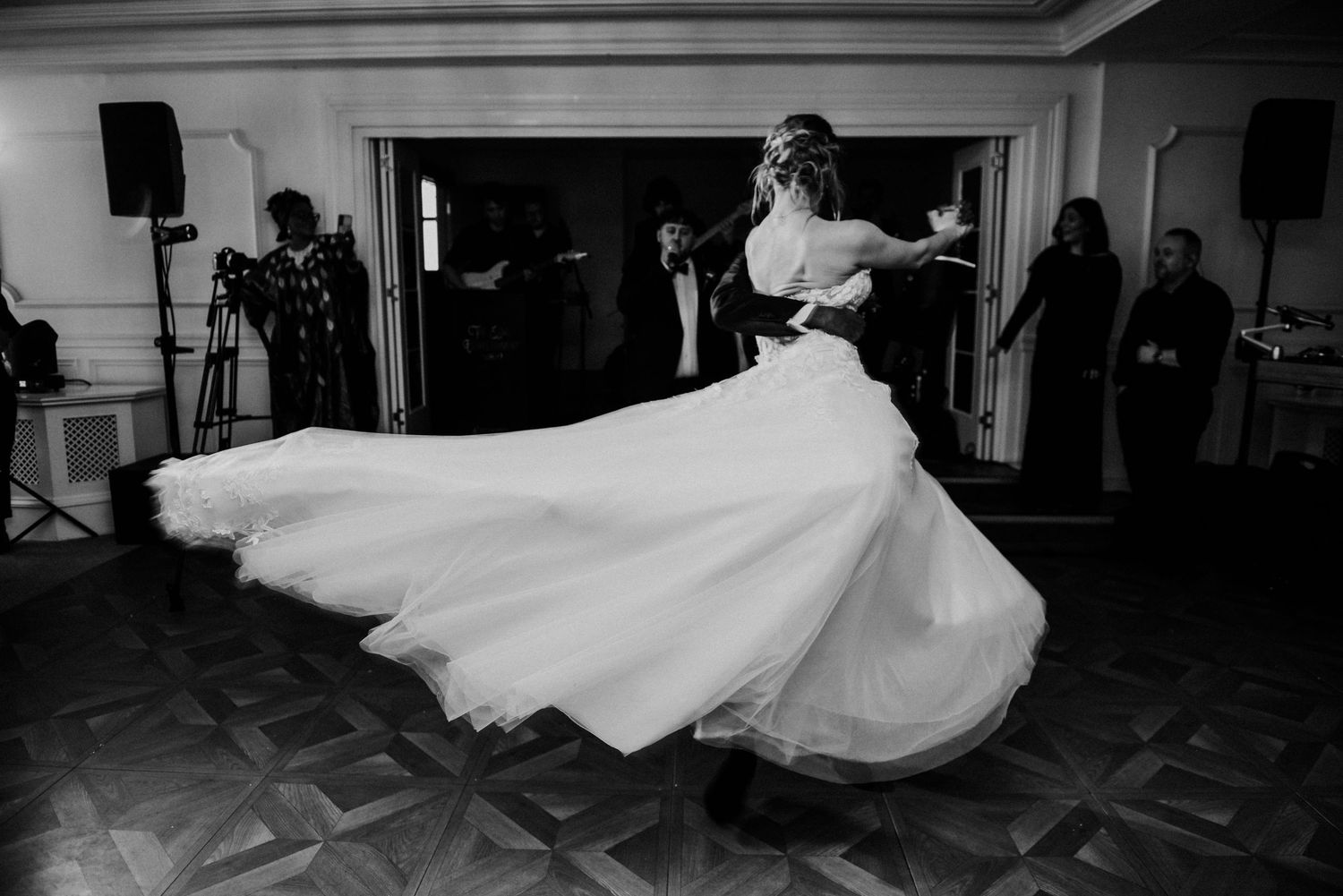 First dance at a wedding reception with colourful lighting and a trailing white dress at Lochgreen Troon Ayrshire