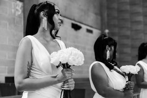A black and white wedding photo collage showing close-up details of bouquets and hands during a celebration.