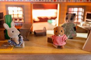 Miniature animal figures inside a toy farmhouse on a table during a wedding at Windmill Farm in Burscough.