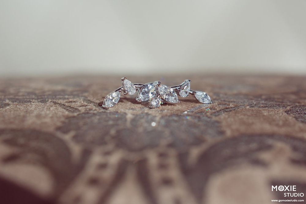 Close-up macro shot of sparkling diamond jewelry with shallow depth of field.