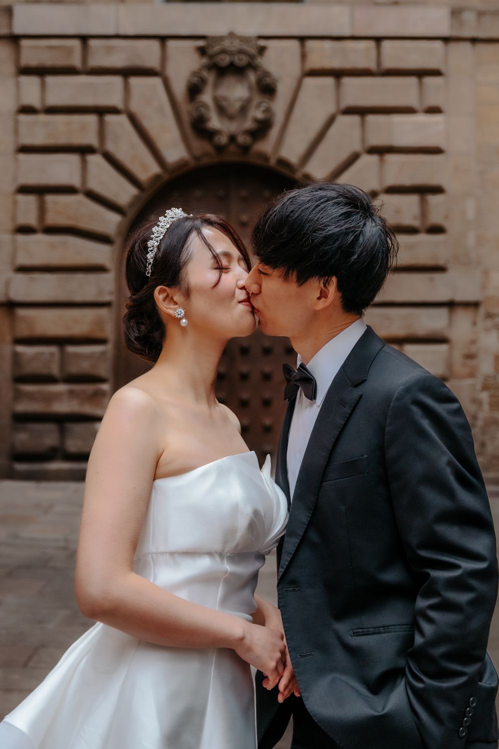 Loving embrace overlooking Barcelona from Park Güell Pre wedding photoshoot Barcelona BarcelonaLoversPH