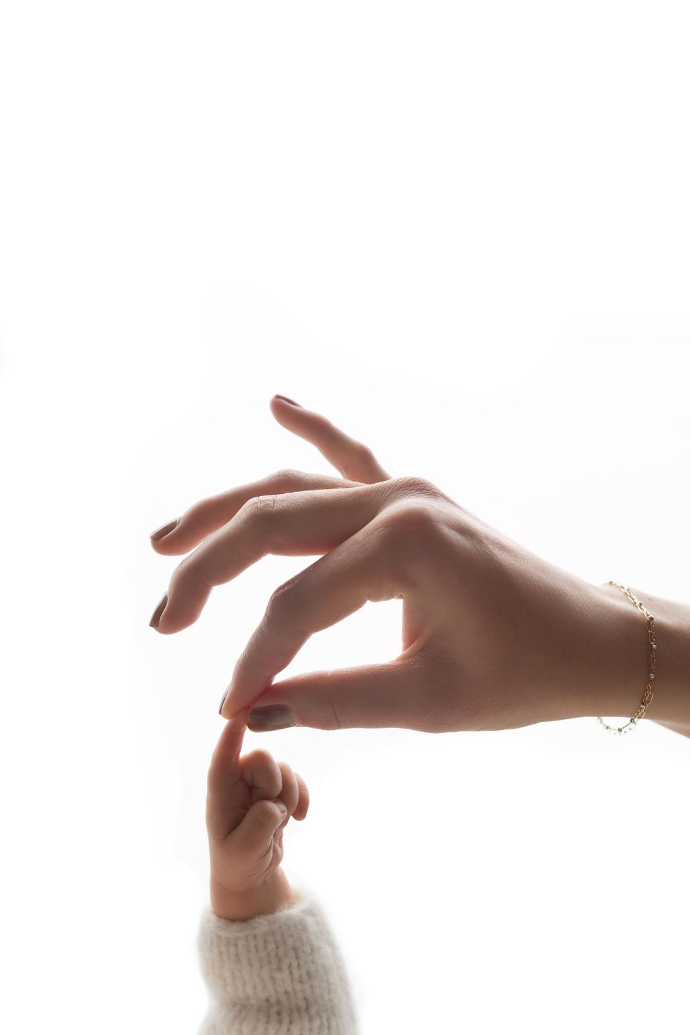 Newborn photo featuring baby and mama's hands, taken by Jen Knightstep, Photographer
