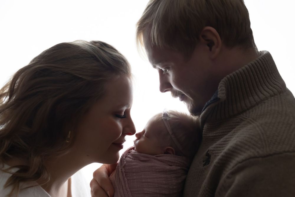 Newborn photo featuring mama and daddy, taken by Jen Knightstep, Photographer