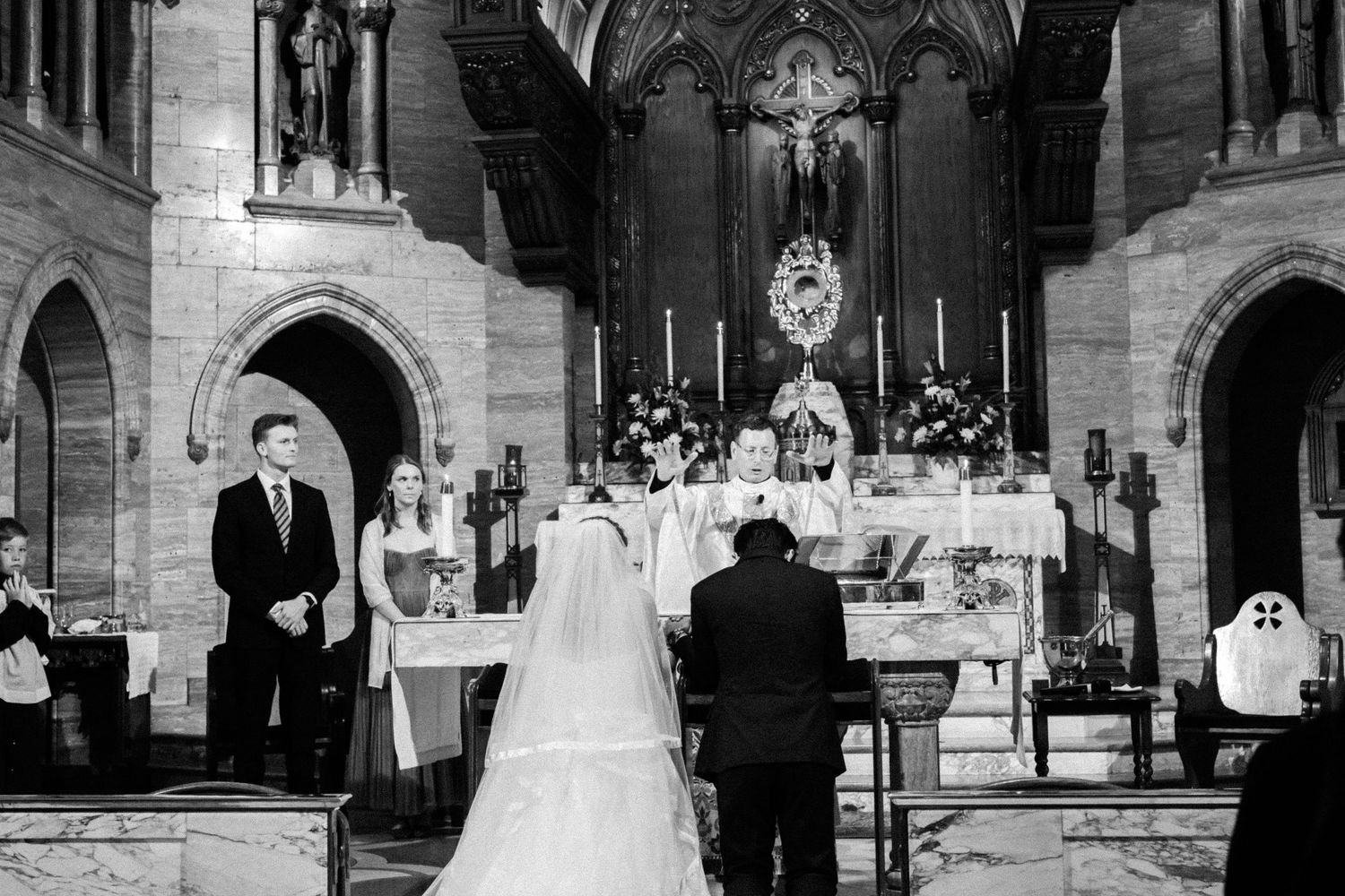 A sequence of black and white wedding ceremony photos showing a couple getting married in a traditional church setting.