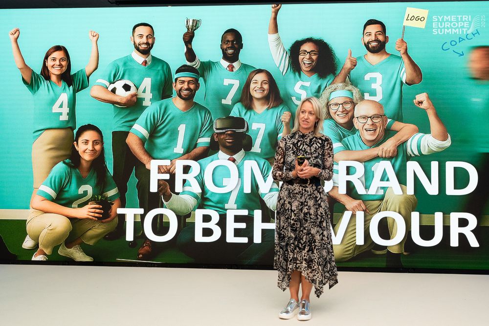 A group of people in teal shirts pose together in a collage of overlapping photos.