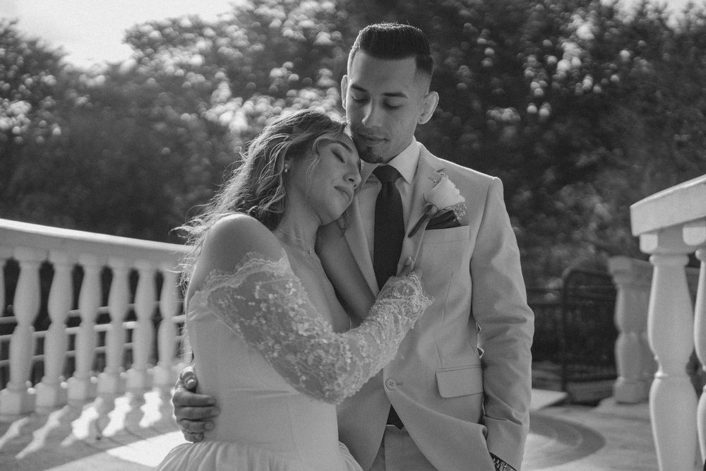 Black and white wedding portraits capturing intimate moments between a couple on their special day.