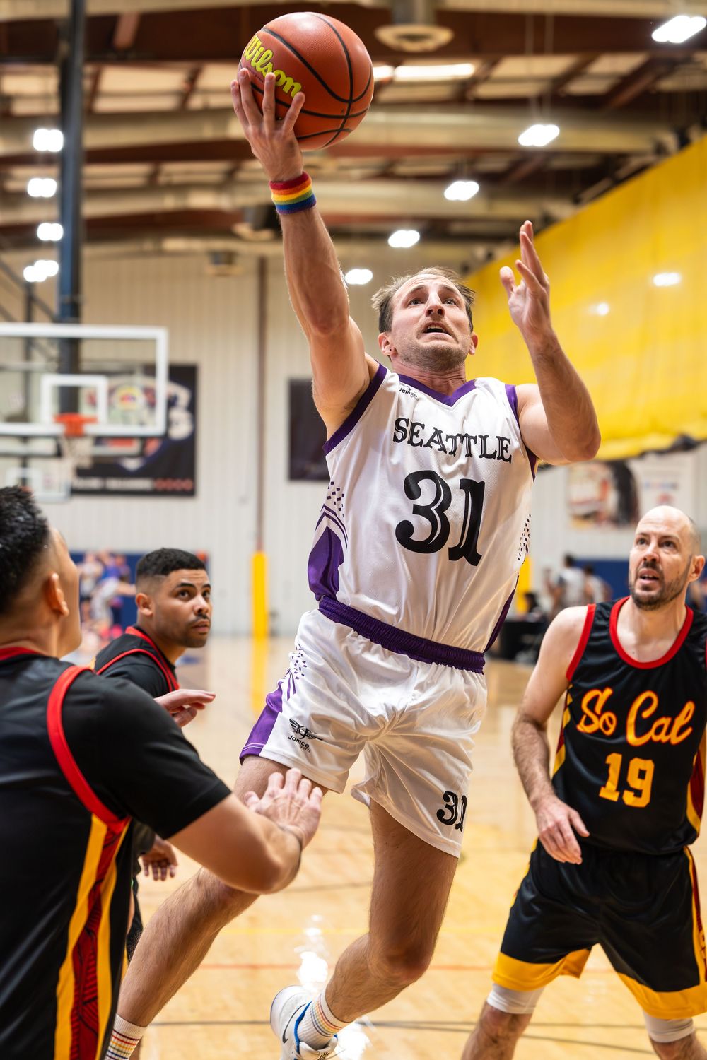 An athlete in the men's division of the basketball tournament makes a layup at Sin City Classic in Las Vegas hosted by the NGBA