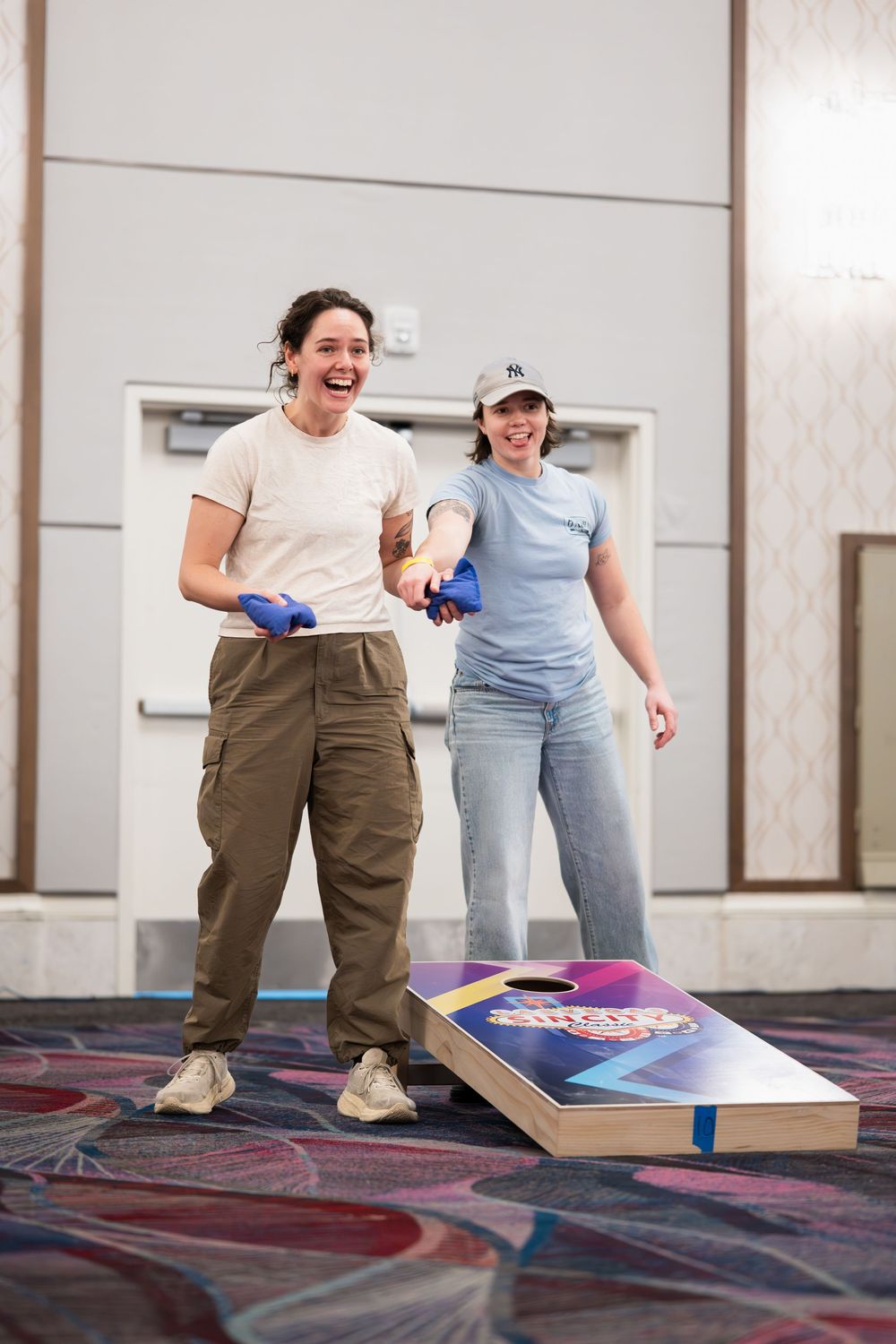 A competitor celebrates a successful bag toss at the Cornhole charity tournament at the start of the Sin City Classic in Las Vegas