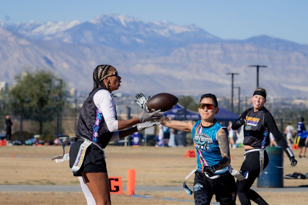 A flag football player makes a catch at the Sin City Classic tournament hosted by NGFFL