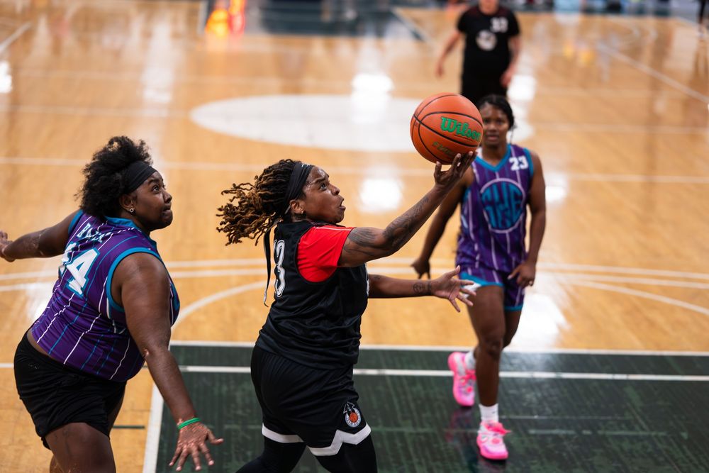 An athlete in the Women's division of the basketball tournament makes a layup at Sin City Classic in Las Vegas