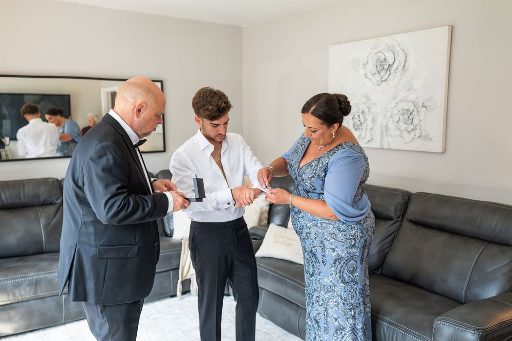 Healthcare workers in a medical office consulting with a patient while reviewing documents together.