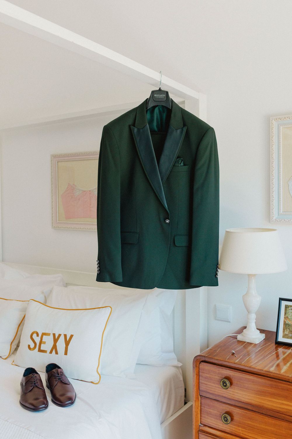 groom suit hanging in preparation room at DOMA Portugal wedding venue near Lisbon