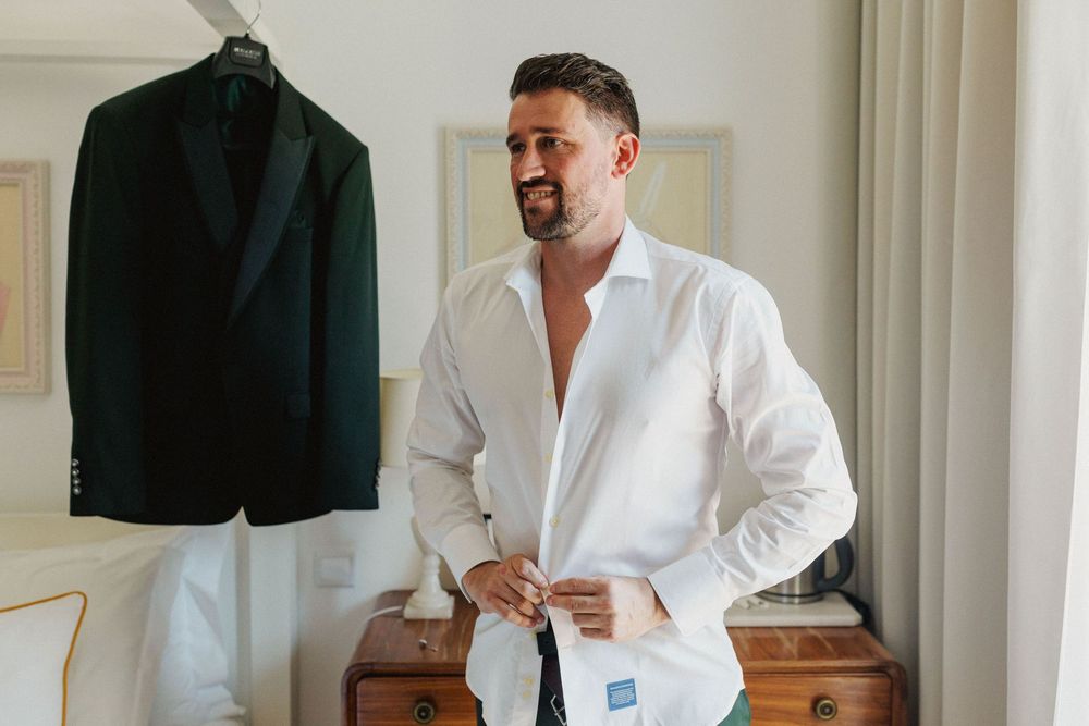 groom getting ready in wedding preparation room at DOMA Portugal near Lisbon