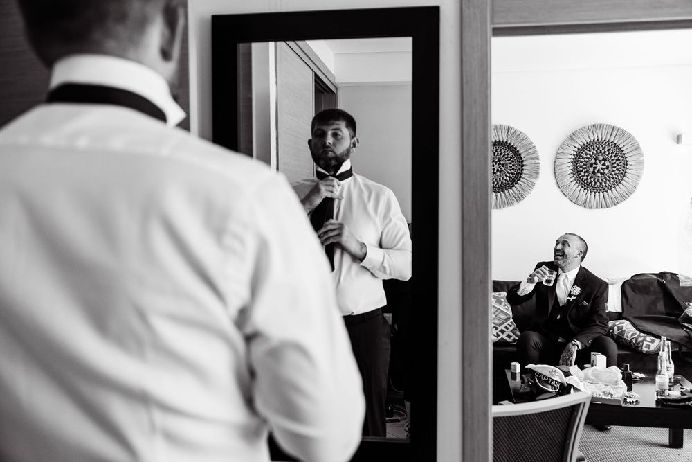British groom preparing for Algarve destination wedding